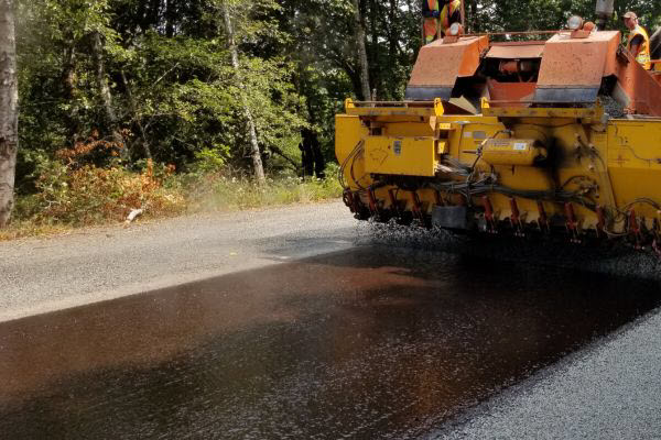 Asphalt Paver Laying New Driveway