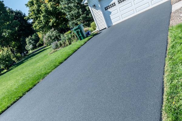 Bitumen Acreage Driveway Leading To Residential Garage